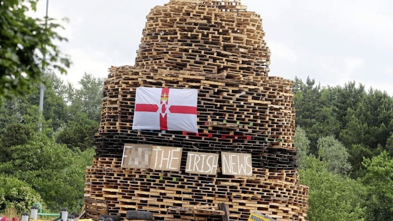 The bonfire built close to Shore Crescent in north Belfast, featuring a profane reference to the Irish News. 