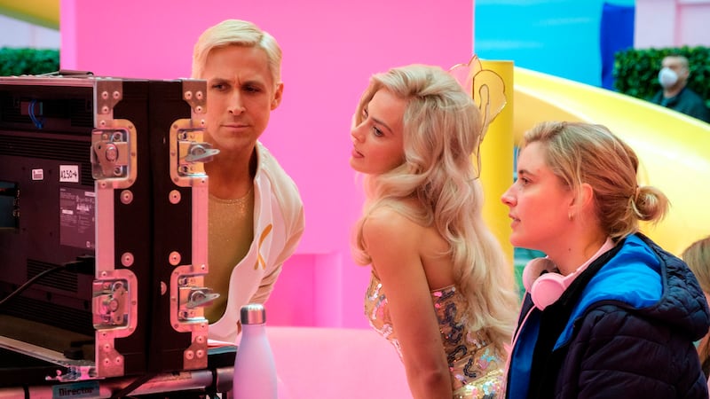 Ryan Gosling and Margot Robbie with director Greta Gerwig on the set of Barbie (Jaap Buitendijk/Warner Bros Pictures/AP)