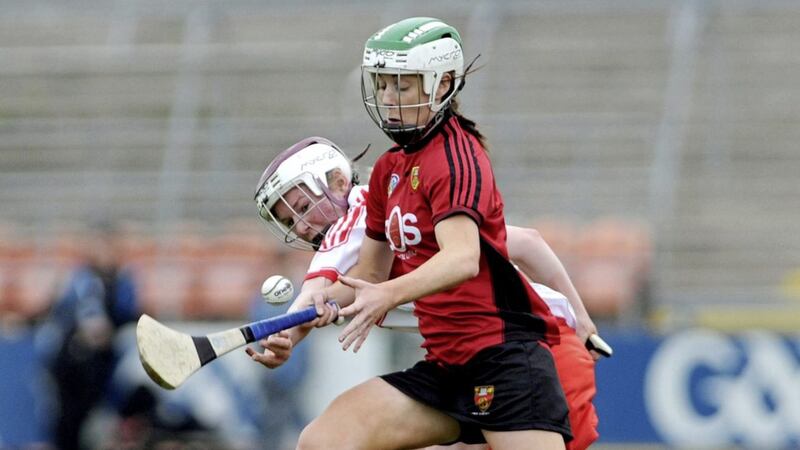 Down camogie's joint-captain Karen McMullan in action against Derry's Aoife Ni Chaiside.<br /> Picture Seamus Loughran