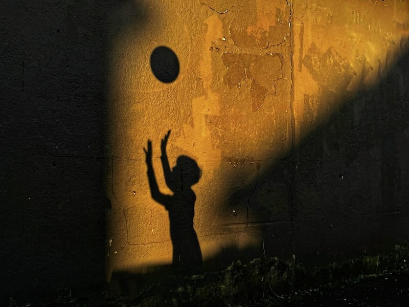 Shadow play: Received third place in the special smartphone category in the IPA awards. The image of a young boy was taken in the late evening sun. Picture by Mal McCann 