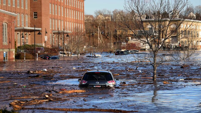 A flooded parking lot at the Hathaway Creative Centre alongside the Kennebec River, Maine (Robert F Bukaty/AP)