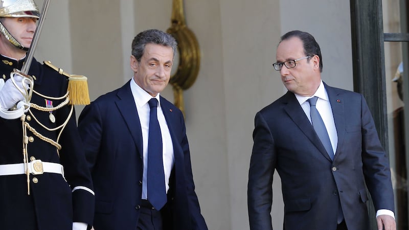 &nbsp;Former French President, Nicolas Sarkozy, leaves the Elysee Palace after a meeting with France's President, Francois Hollande, right, in Paris, Sunday, Nov. 15, 2015. (AP Photo/Jacques Brinon)