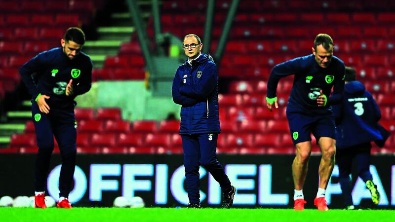 Martin O'Neill watches training on the eve of Republic of Ireland's World Cup clash with Denmark