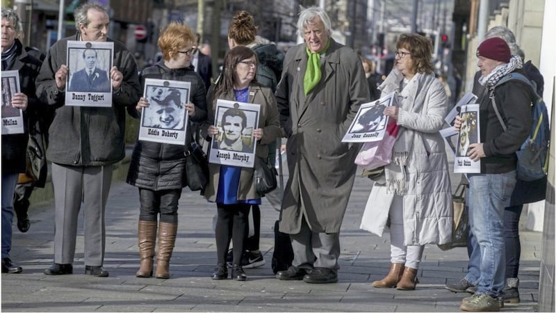Barriste Michael Mansfield QC with families of the Ballymurphy victims outside the court in Belfast. Picture by Hugh Russell 