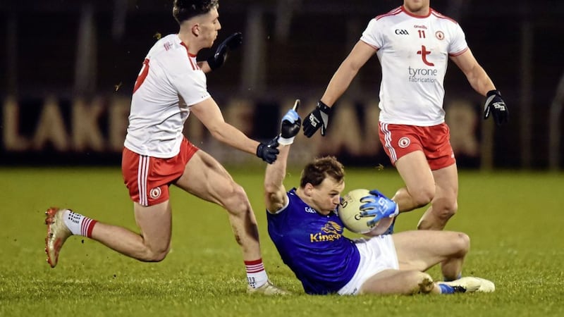 Cavan goalscorer and 'man of the match' Gearoid McKiernan wins possession against Tyrone duo Joe Oguz and Kieran McGeary in the Dr McKenna Cup at Kingspan Breffni.<br /> Picture: Oliver McVeigh