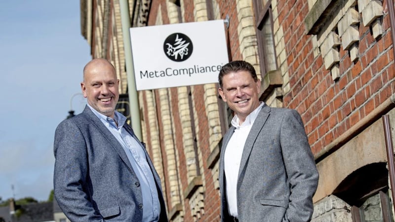 MetaCompliance chief executive Robert O&#39;Brien (right) with Invest NI director John Hood 
