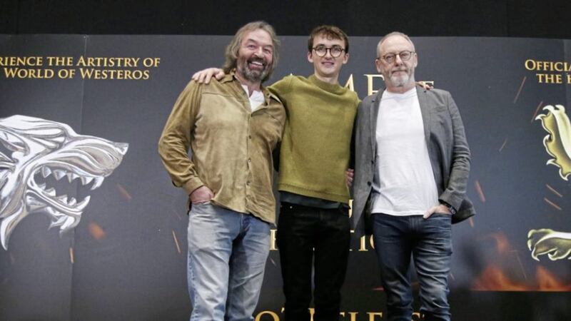 Left to right; actors Ian Beattie, who plays Meryn Trant, Isaac Hempstead Wright, who plays Bran Stark, and Liam Cunningham, who plays Davos Seaworth, at the launch of the Game of Thrones touring exhibition at the Titanic Exhibition Centre in Belfast. Picture by Hugh Russell. 