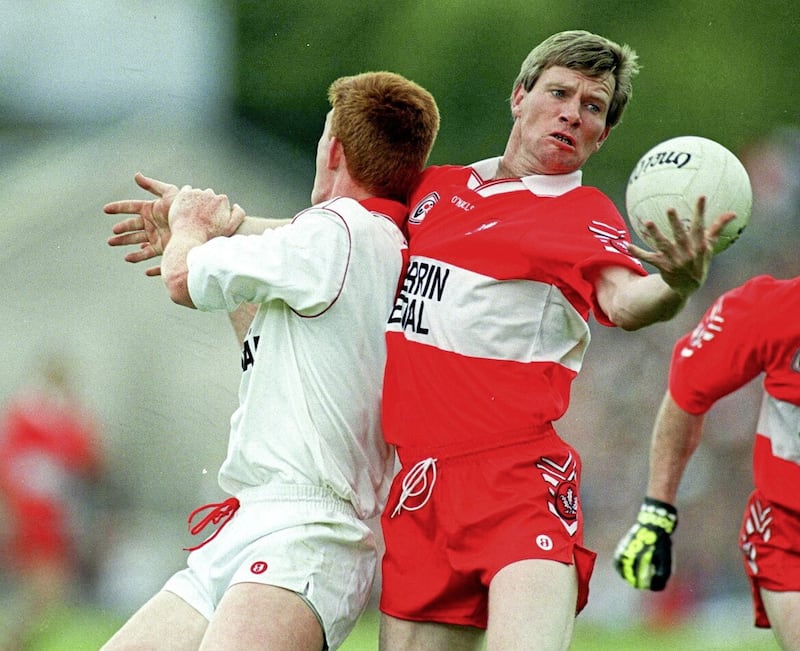 Tony Scullion of Derry in action against Ciaran McBride of Tyrone during the Ulster GAA Football Senior Championship Semi-Final match between Tyrone and Derry at St. Tiernach&#39;s Park in Clones, Monaghan. Photo by Brendan Moran/Sportsfile 