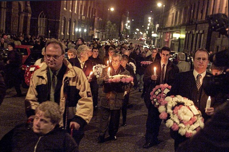 A candle light procession leaves St Patrick&#39;s Church, Donegall Street, Belfast, to mark the 30th anniversary of the bomb which killed 15 people in McGurk&#39;s Bar 