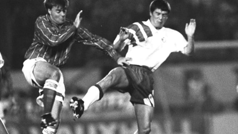 Northern Ireland's Mal Donaghy and Republic of Ireland's Roy Keane battle for the ball on November 1993