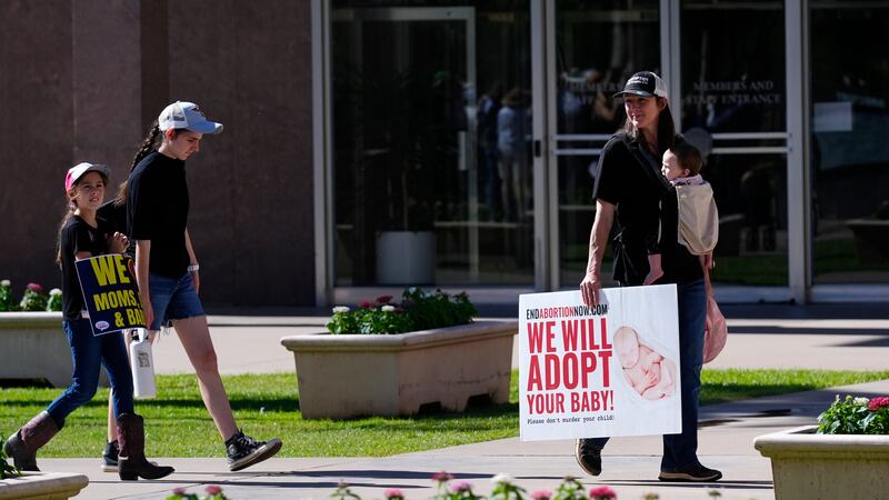 Pro-life demonstrators in the front of the Arizona Capitol prior to the vote (Ross D Franklin/AP)