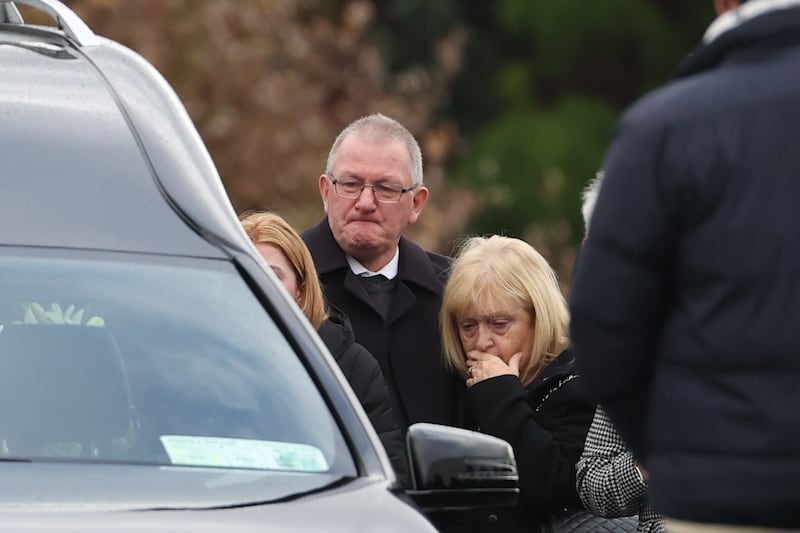 The family of Jessica Gallagher, 24, watch as her coffin leaves St Michael's Church, Creeslough, after her funeral mass.