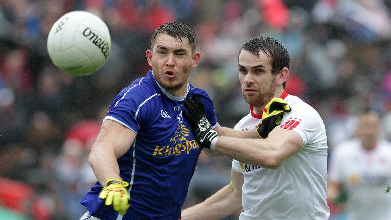Cavan's David Givney battles for possession with Tyrone's Ronan McNamee at Clones last Sunday Picture by Philip Walsh