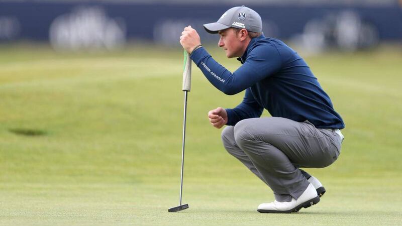 Ireland's Paul Dunne lines up a putt during day four of The Open Championship 2015 at St Andrews, Fife.&nbsp;