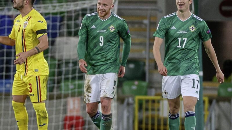 Goalscorer Liam Boyce (left) and Paddy McNair look happy after Northern Ireland take the lead against Romania - but it finished in a 1-1 draw.<br /> Photo Desmond  Loughery/Pacemaker Press