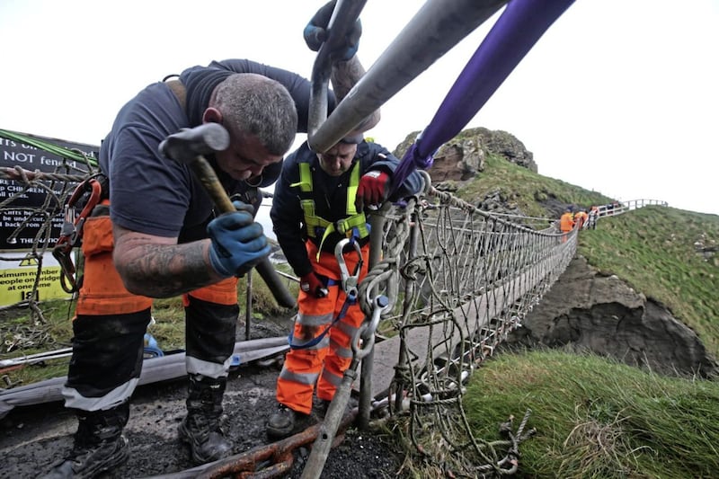 Workmen pictured during the replacement of the Carrick-A-Rede Rope Bridge. The rope bridge is replaced every five years. Photo by Steven McAuley/McAuley Multimedia 
