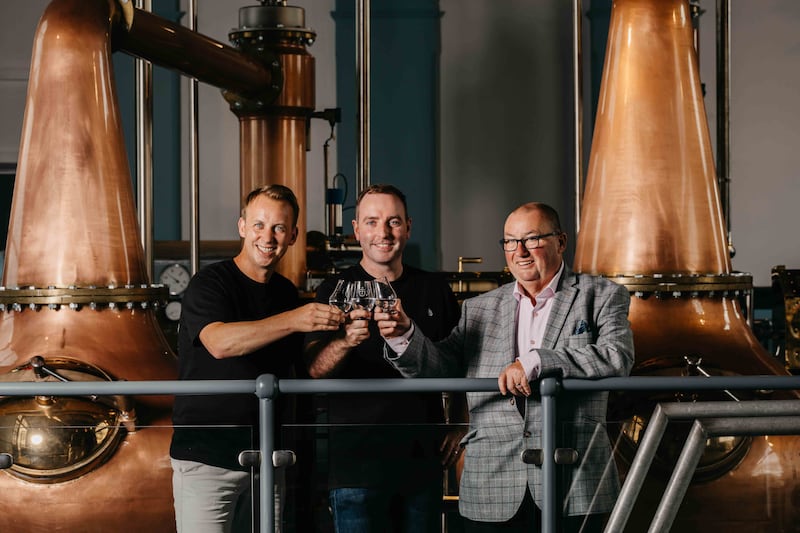  Titanic Distillers' directors Stephen Symington (left) and Peter Lavery (right) with head distiller Damien Rafferty, celebrating the start of production at Belfast’s first working whiskey distillery since the 1930s.
