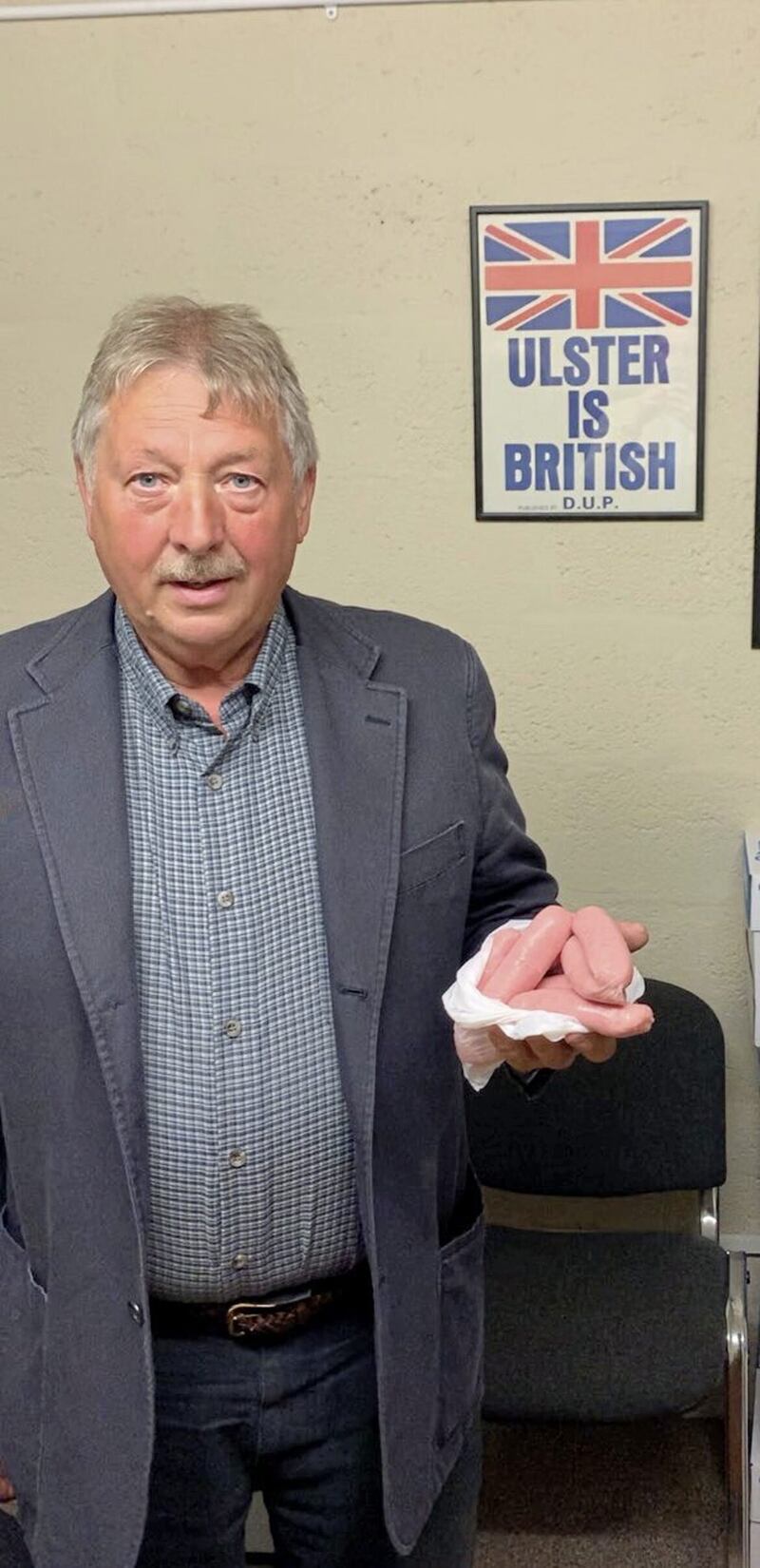 DUP MP Sammy Wilson tweeted a picture of himself holding sausages in 2021, claiming &quot;chilled British sausages are a threat to the peace process&quot; and calling for the &quot;farcical&quot; Northern Ireland Protocol to go 