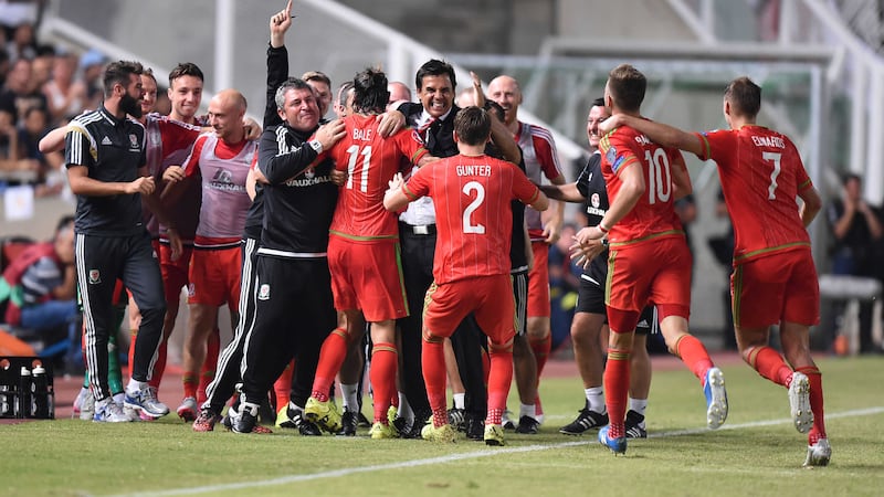Gareth Bale is mobbed by the Wales bench after scoring the winner in Thursday's Euro 2016 qualifier against Cyprus in Nicosia<br />Picture: PA