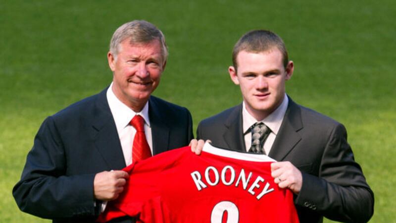 Manchester United's new signing Wayne Rooney (right) and manager Sir Alex Ferguson on September 1 2004