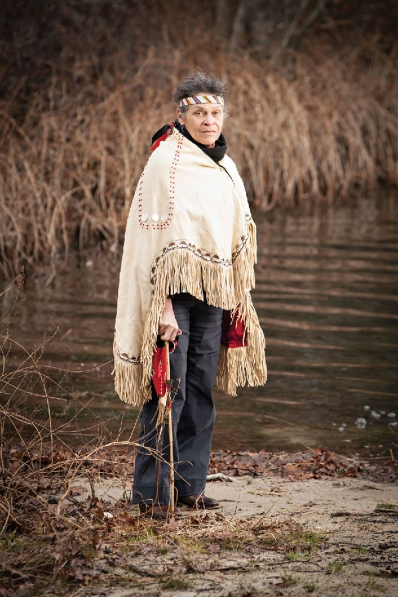 Wampanoag artist Ramona Peters, also known as Nosapocket, dressed in traditional clothes, which will be on display as part of a major exhibition