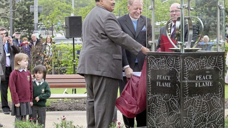 Martin Luther King III, son of the assassinated US civil rights&#39; leader, at the official unveiling of the peace flame in 2013 along with Rev David Latimer and then Derry mayor Kevin Campbell. Picture by Margaret McLaughlin 