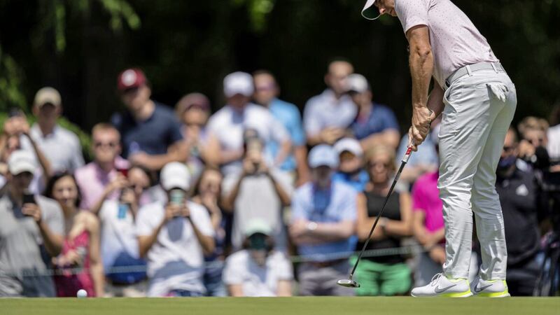 Rory McIlroy watches his putt on the third hole during the fourth round of the 2021 Wells Fargo Championship golf tournament at Quail Hollow. 