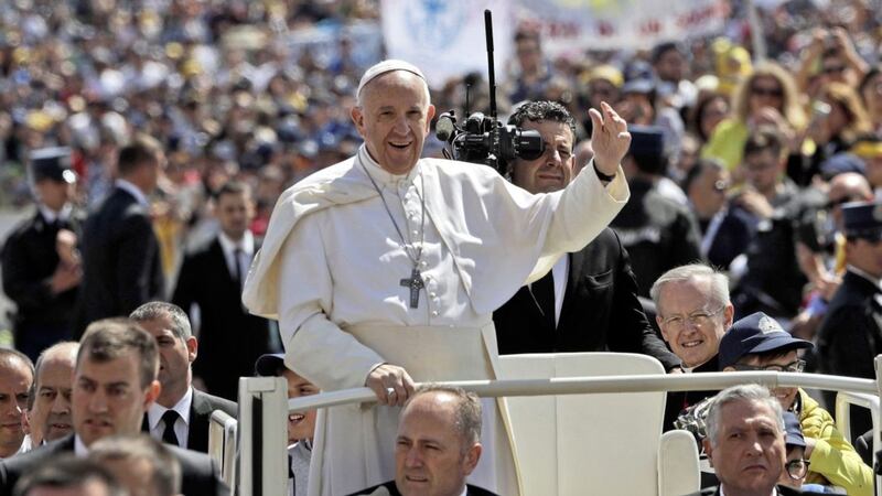 Pope Francis waves as he is driven through the crowd in St. Peter&#39;s Square at the Vatican, Sunday April 30, 2017. (AP Photo/Alessandra Tarantino). 