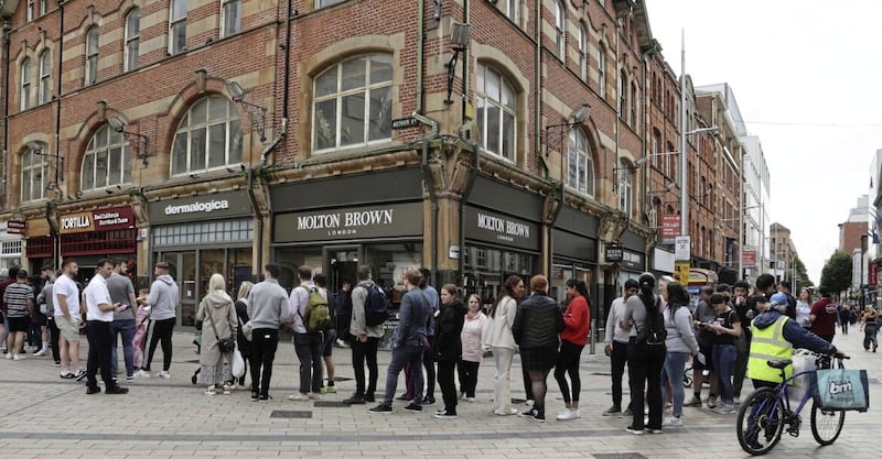 Customers queued outside Tortilla&#39;s new Belfast venue on Arthur Square. Picture by Hugh Russell. 