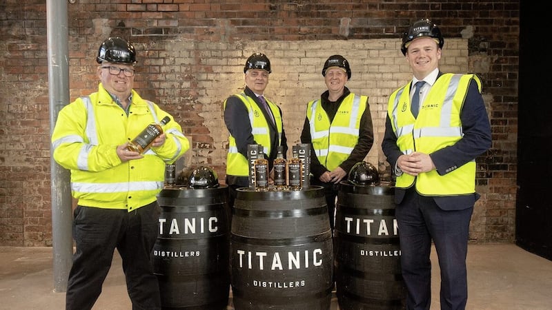Titanic Distillers directors Peter Lavery and Richard Irwin with economy minister Gordon Lyons and Invest NI interim chief executive Mel Chittock 