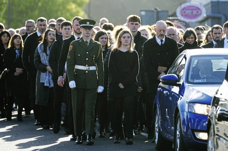 Family and friends walk behind the hearse carrying the remains of Martina Martin whose Requiem Mass was celebrated today in Creeslough. Picture by Brian Lawless, PA 