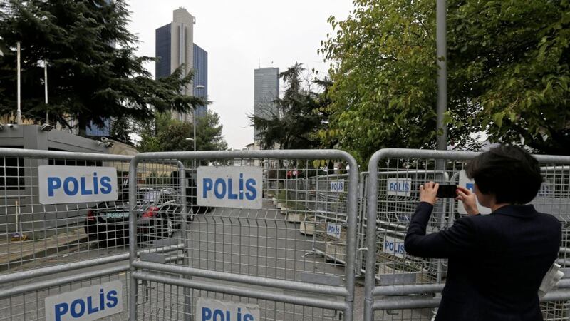 A journalist shoots video behind barriers blocking the road leading to Saudi Arabia&#39;s consulate in Istanbul Picture by Lefteris Pitarakis/AP 