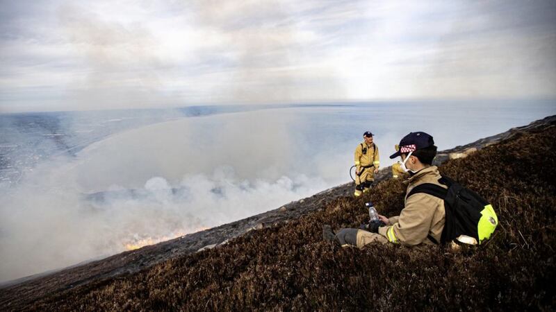 Firefighters tackling the large gorse fire in the Slieve Donard area of the Mourne Mountains over the weekend. Picture by Conor Kinahan/Pacemaker Press 