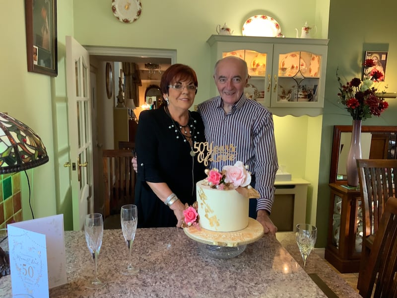 Dennis and Susan celebrating their 50th Wedding Anniversary with a cake