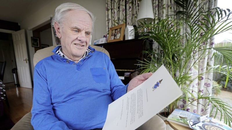 Dr Norman Hamilton pictured at his home in Ballymena with the letter from Pope Francis. Picture by Hugh Russell 