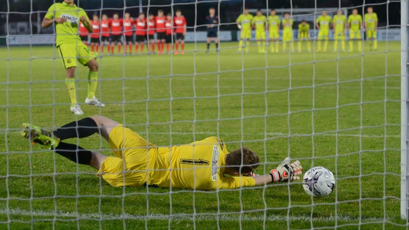 County Antrim's Jack Ferguson saves a penalty during Friday night's shoot out in Ballymena<br/>Picture: Pacemaker&nbsp;