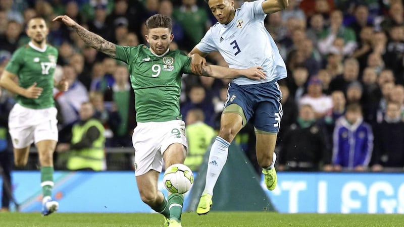 Northern Ireland&#39;s Jamal Lewis (right) up against the Republic of Ireland&#39;s Sean Maguire in last year&#39;s friendly in Dublin. 