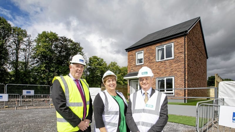 Outgoing Clanmil group chief executive, Clare McCarty (centre), at a new housing development in Carrickfergus with former McAvoy managing director, Eugene Lynch (left) and David Orr of the National Housing Federation. 