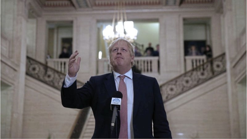 Boris Johnson talks to the media at Stormont. Picture by Hugh Russell 