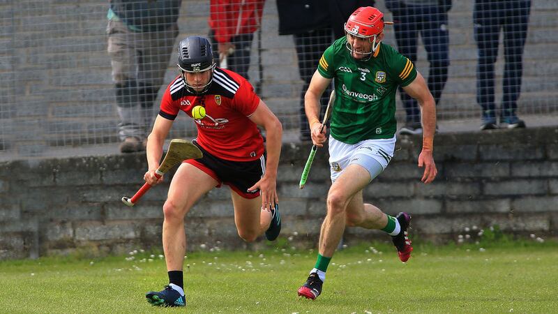 Down's Daithi Sands gets away from Meath's Sean Geraghty during Saturday's Joe McDonagh Cup clash in Ballycran. Picture by Seamus Loughran