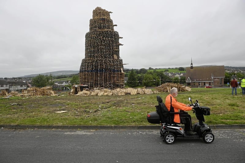 The bonfire in Antiville, Larne County Antrim where John Steele lost his life on Saturday evening.  Mr Steele fell from the top and was pronounced dead by paramedics later at the scene.. 