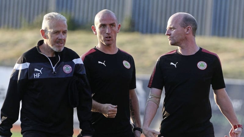 Harry Fay during his coaching days at Cliftonville alongside Barry Johnston (centre) and Barry Gray (right) 