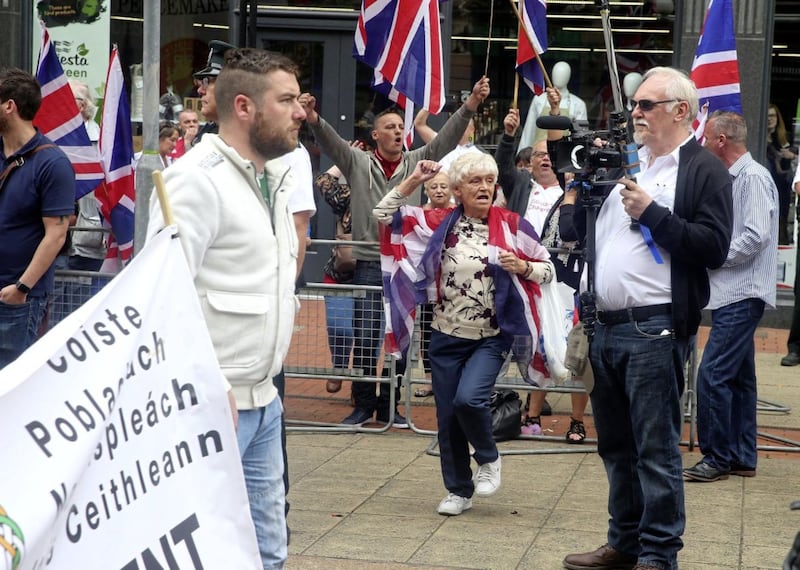 Loyalists hold a counter-demonstration during the Anti-Internment League parade through Belfast city centre. Picture Mal McCann 