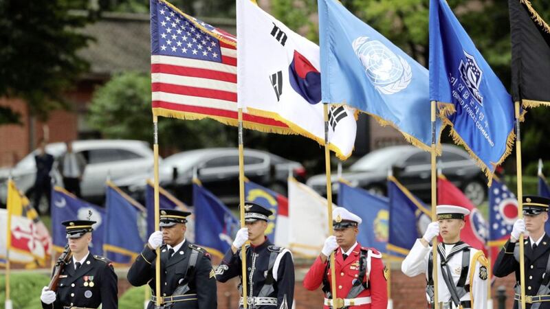 UN Command honour guards carry flags of the US, UN and South Korea at Yongsan Garrison American military base in Seoul, South Korea PICTURE: Lee Jin-man/AP 