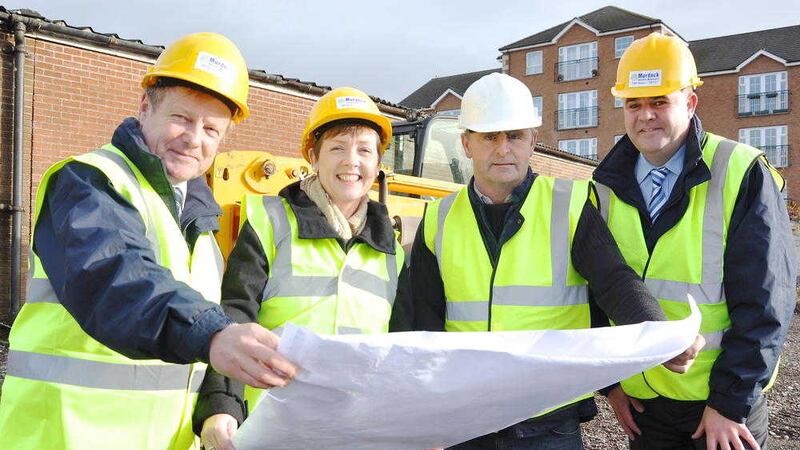 Murdock Builders&rsquo; Merchants chief executive Ann Morgan unveils plans for the company&#39;s new Castlereagh Road branch in 2014 with Trevor Weir (senior manager), Pat Rodgers (contractor) and Ken Robson (branch manager). 