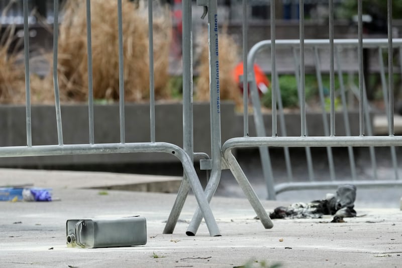 A metal can on the ground at the scene (Mary Altaffer/AP)