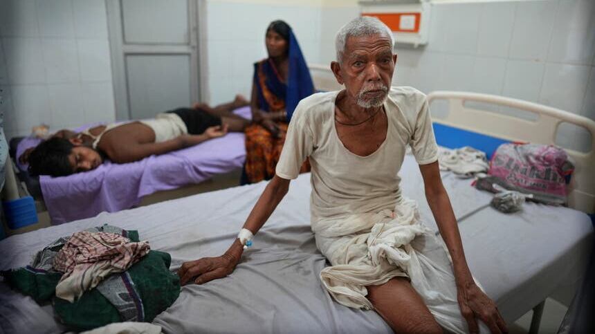 A elderly person recovers at the overcrowded government district hospital in Ballia, Uttar Pradesh state (AP)