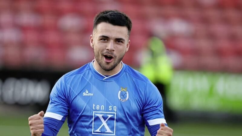 Dungannon&#39;s Joseph Moore celebrates scoring the winner at Solitude on Saturday Picture by Desmond Loughery/Pacemaker 