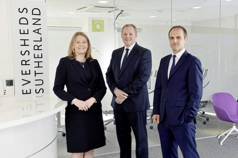 Eversheds Sutherland Belfast partners Lisa Bryson, Gareth Planck and Matthew Howse at the firm&#39;s new Belfast city centre offices. 
