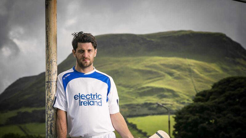Antrim hurler Shane McNaughton with the stunning backdrop of Lurig Mountain which towers over Cushendall